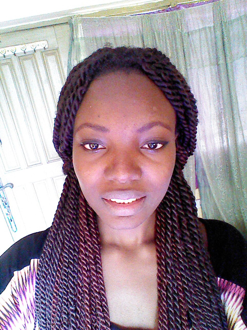 Black woman with long, beautiful Senegalese twists